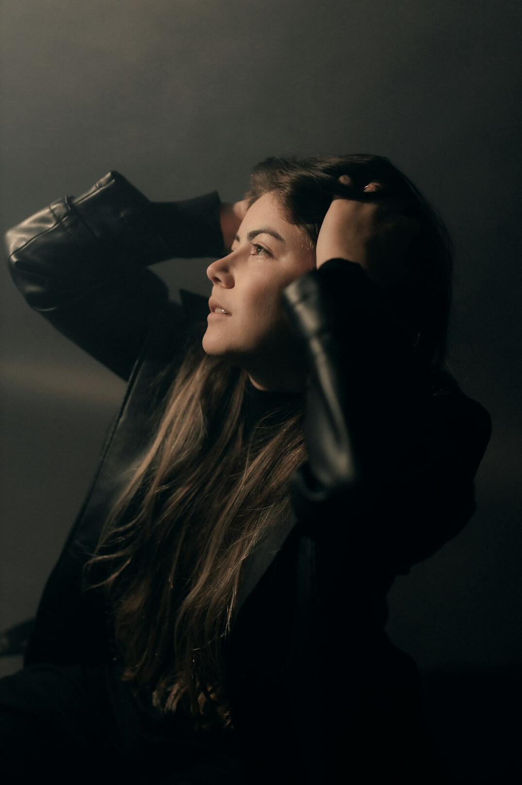 Studio portrait of a woman camera operator instructor