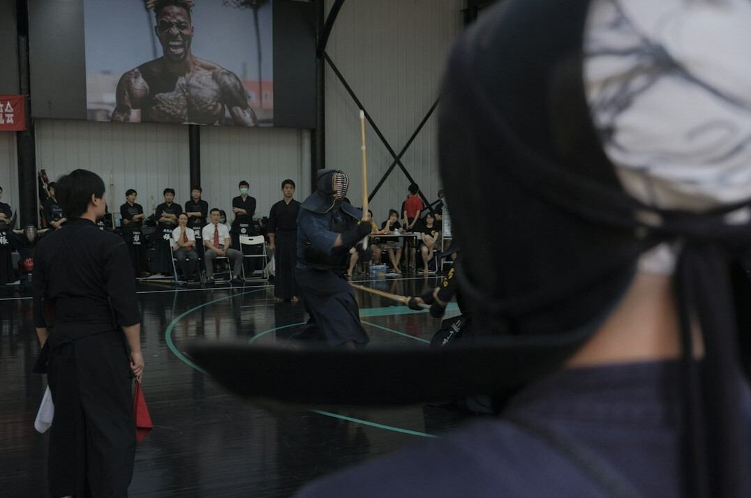 Instructor teaching students in a television gallery